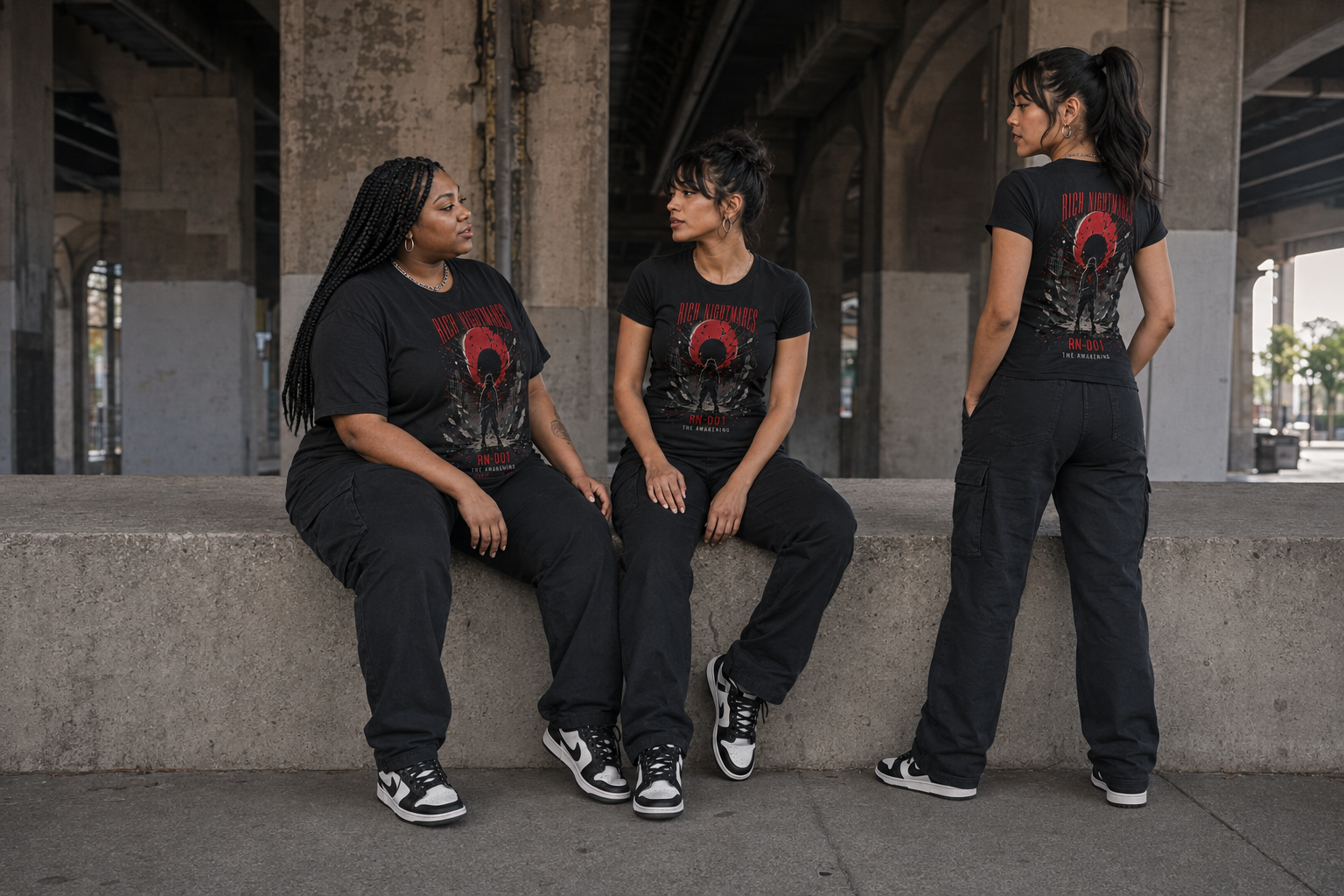 Three adult models in MMORBIT Awakening T-shirts sharing a candid campaign moment in Chicago