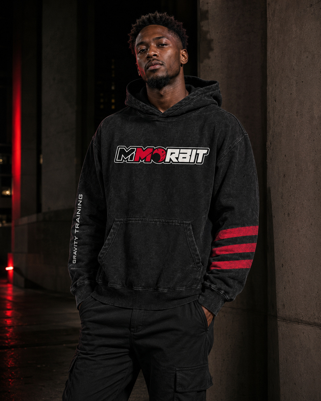 Model wearing the black MMORBIT Gravity Training hoodie