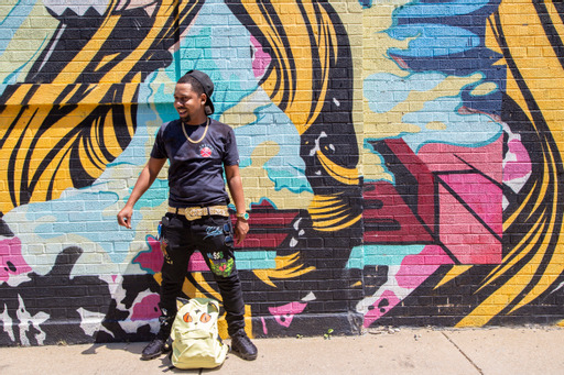 Mike Moore in front of a colorful Chicago mural